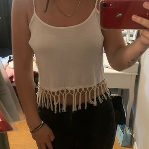 white tank with dangling strings